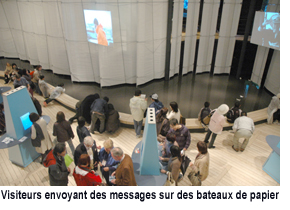 Visitors sending messages on paper boats