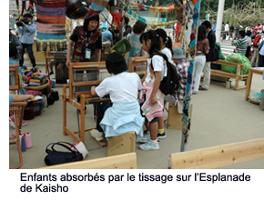 Children engrossed in weaving at the Kaisho Plaza