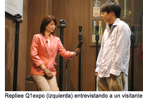 Repliee Q1expo (left) interviewing a guest