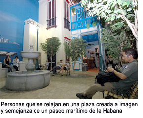 People relaxing in a square fashioned after Havana's waterfront street