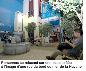 People relaxing in a square fashioned after Havana's waterfront street