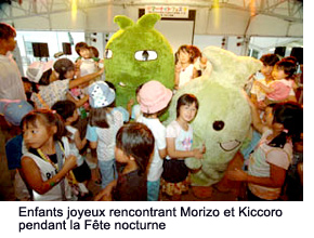 Happy children meeting Morizo and Kiccoro during the Summer Night Festa