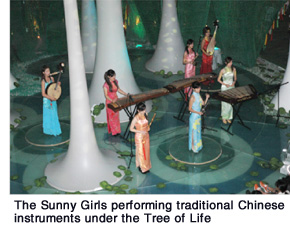 The Sunny Girls performing traditional Chinese instruments under the Tree of Life