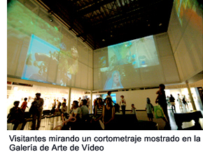 Visitors looking up at the footage shown at the Video Art Gallery